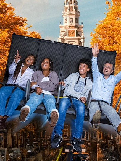 Visitors enjoying the 5D Ultimate Flight Experience at This Is Holland with Amsterdam backdrop.