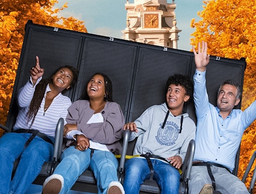 Visitors enjoying the 5D Ultimate Flight Experience at This Is Holland with Amsterdam backdrop.