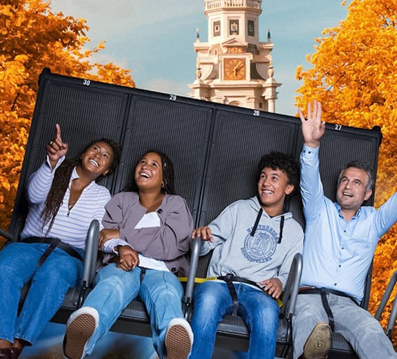 Visitors enjoying the 5D Ultimate Flight Experience at This Is Holland with Amsterdam backdrop.