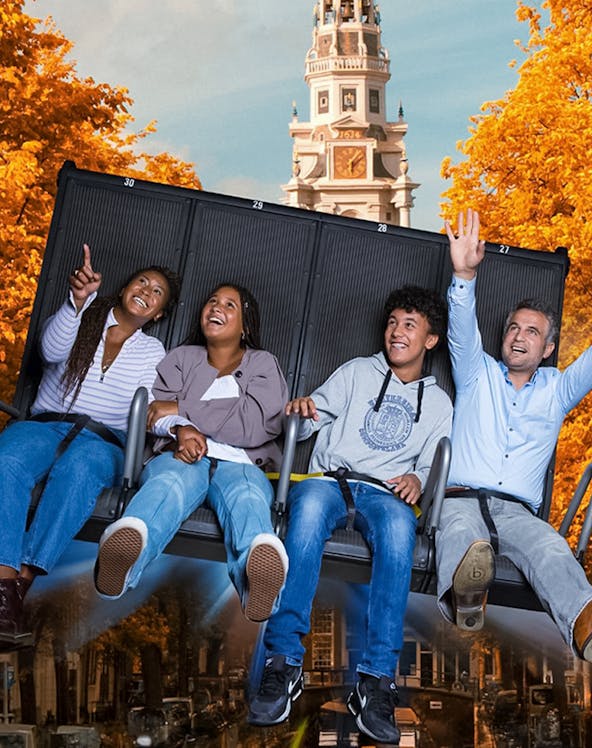 Visitors enjoying the 5D Ultimate Flight Experience at This Is Holland with Amsterdam backdrop.
