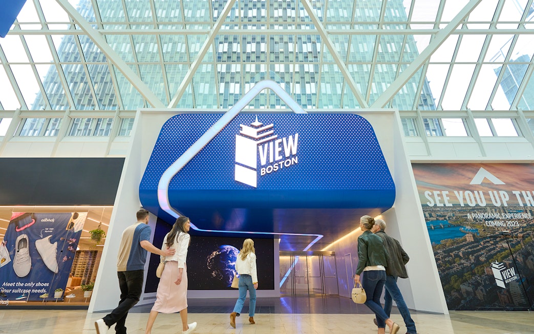 Entrance to View Boston observation deck with visitors walking inside.