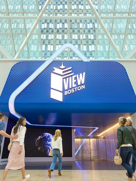 Entrance to View Boston observation deck with visitors walking inside.