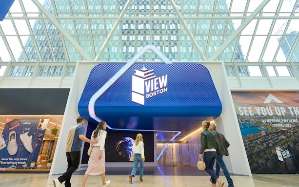Entrance to View Boston observation deck with visitors walking inside.