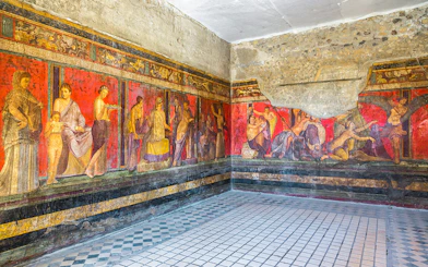 Frescoes in the Villa of the Mysteries, Pompeii, Italy, depicting ancient Roman life.