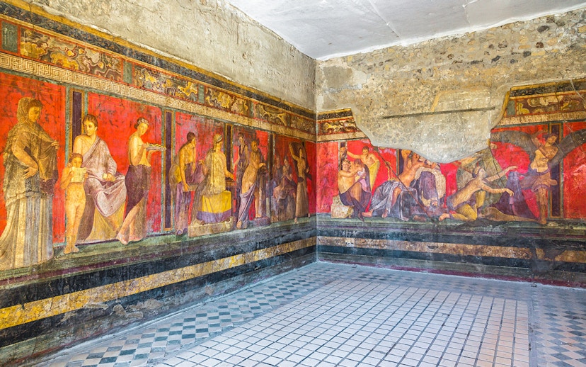 Frescoes in the Villa of the Mysteries, Pompeii, Italy, depicting ancient Roman life.