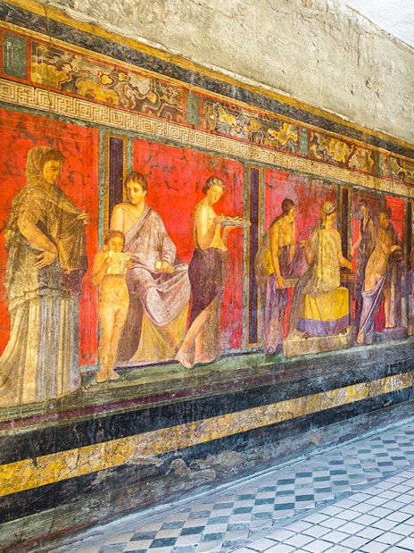 Frescoes in the Villa of the Mysteries, Pompeii, Italy, depicting ancient Roman life.