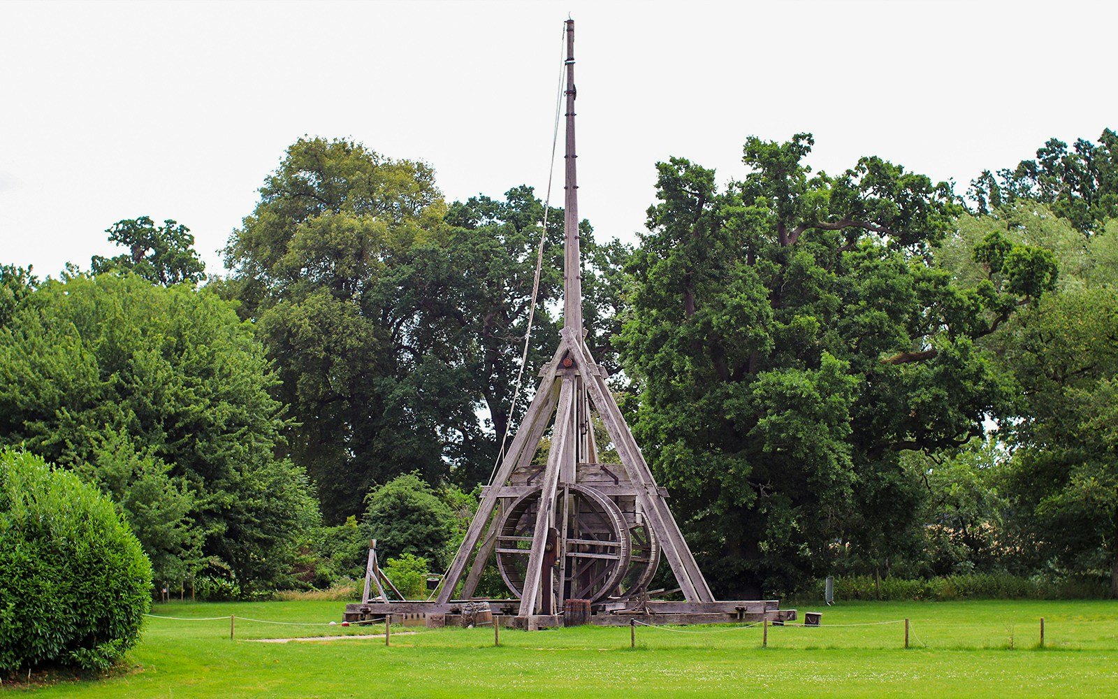 Trebuchet at Warwick Castle surrounded by trees.