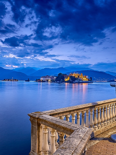 View of Isola Bella from a lakeside terrace with telescope, Isole Borromee tour.