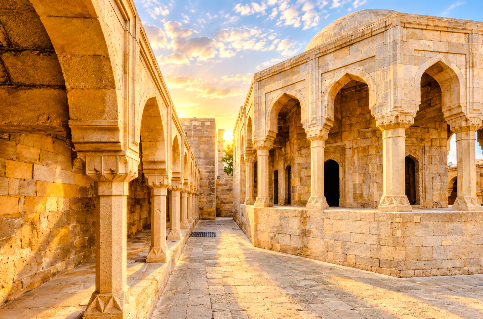 Palace of the Shirvanshahs courtyard with arches at sunset, Baku.