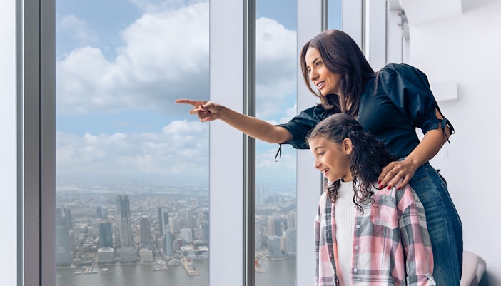 Ground Zero guided tour group at 9/11 Memorial, New York City, with skip-the-line museum tickets.