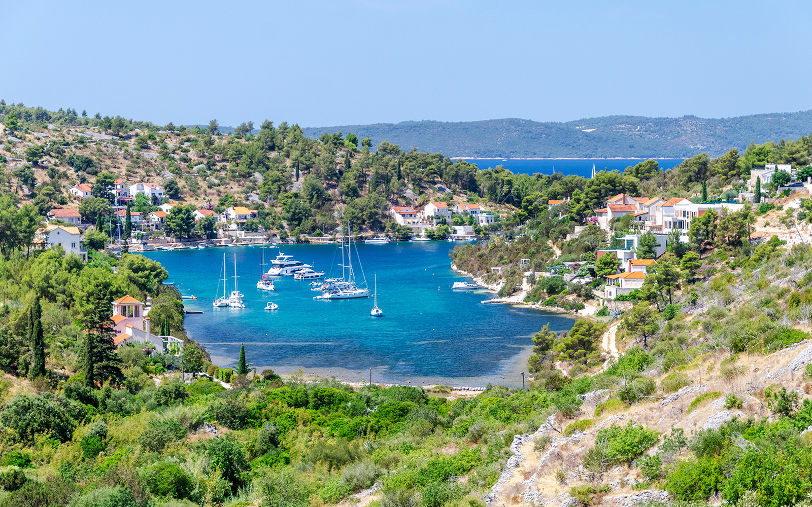 Scenic view of Bobovisca harbor with boats on Brac island, Croatia.