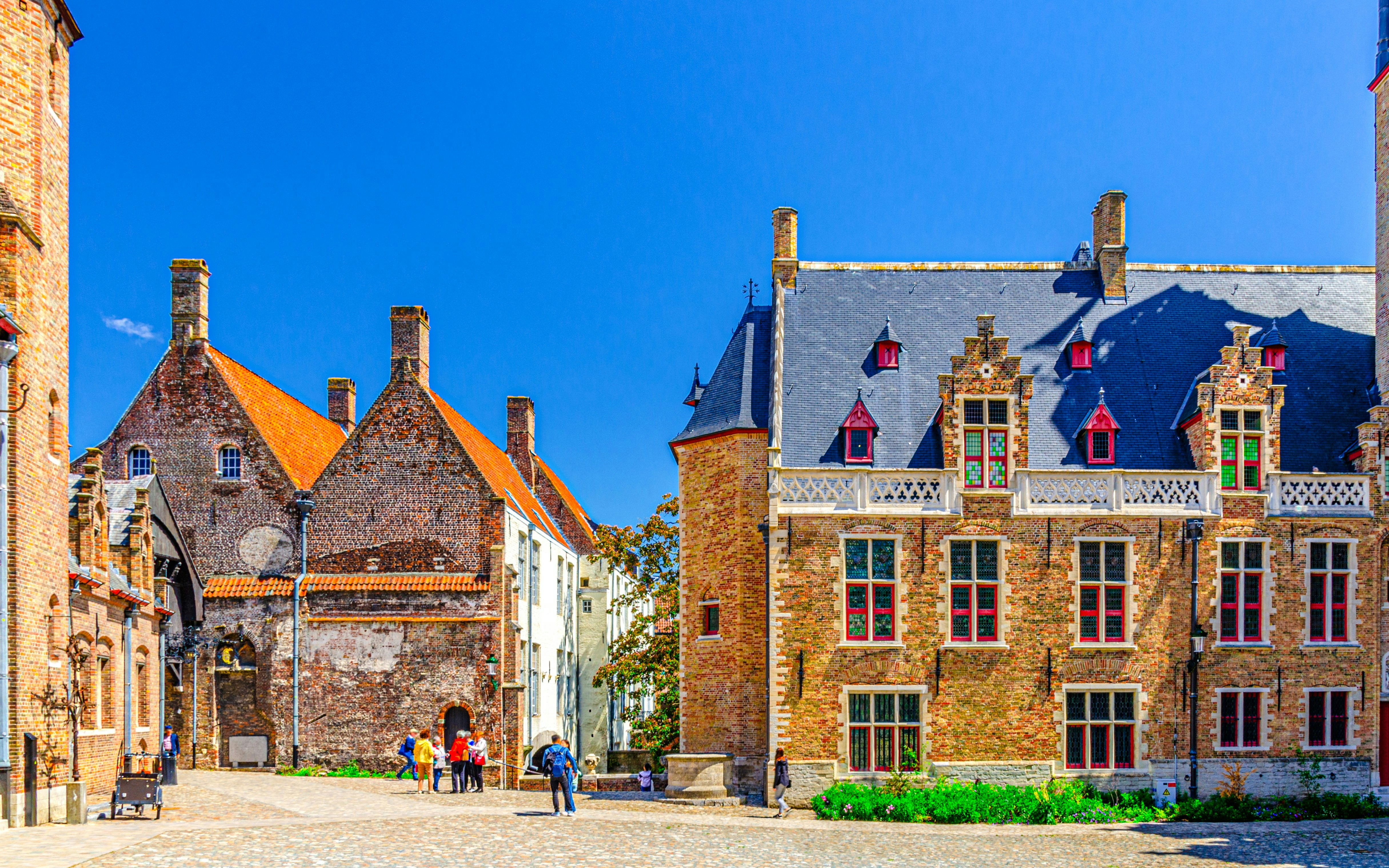 Gruuthuse Museum building with tourists in Bruges, Belgium.