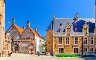 Gruuthuse Museum building with tourists in Bruges, Belgium.