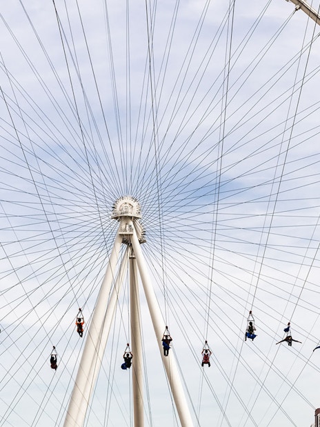 Las Vegas High Roller with zipliners in foreground, part of Go City Explorer attractions.