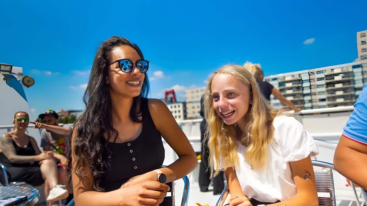 Guests enjoying a sunny day on a city cruise.