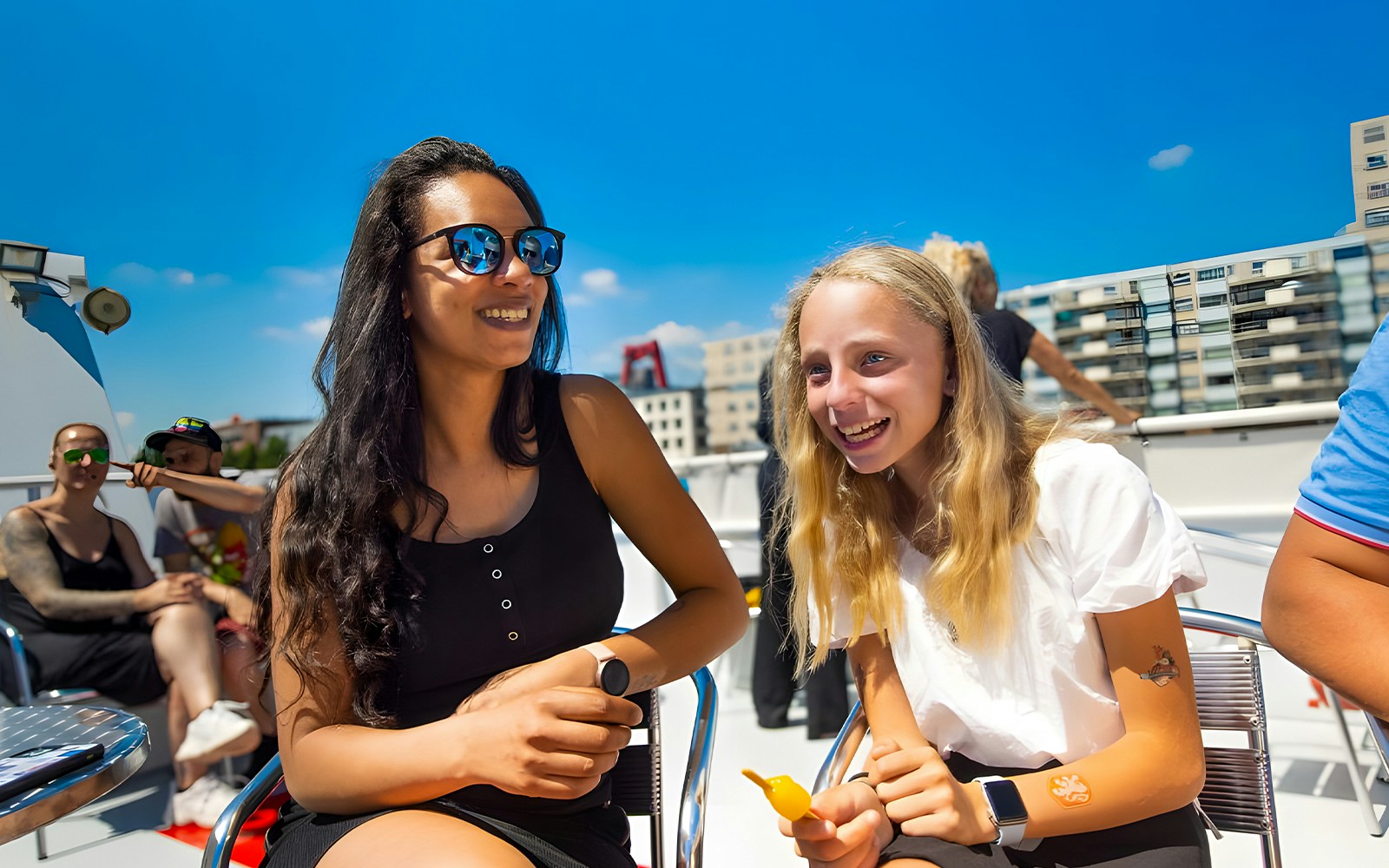 Guests enjoying a scenic cruise on the Seine River with views of the Eiffel Tower in Paris, France.