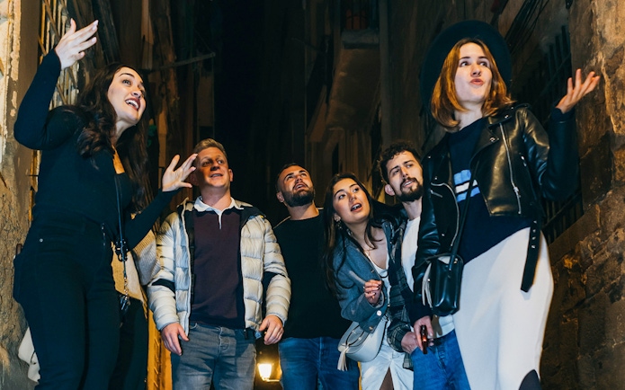 Group exploring narrow street on Barcelona walking tour.
