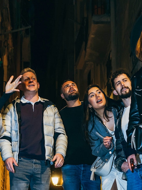 Group exploring narrow street on Barcelona walking tour.