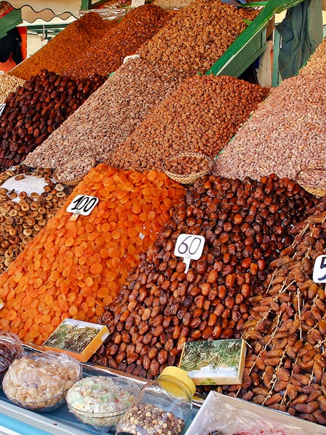 Dried fruits and nuts displayed at a market stall during a Marrakech night walking tour.