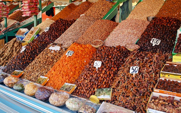 Dried fruits and nuts displayed at a market stall during a Marrakech night walking tour.