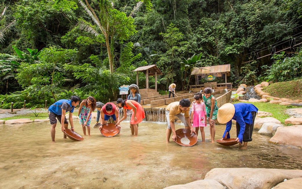 Visitors panning for gold at Sunway Lost World of Tambun, Malaysia.