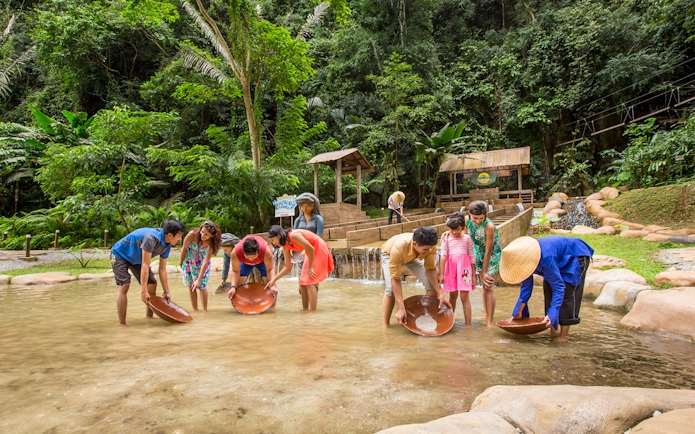 Visitors panning for gold at Sunway Lost World of Tambun, Malaysia.
