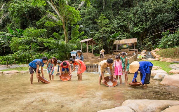Visitors panning for gold at Sunway Lost World of Tambun, Malaysia.