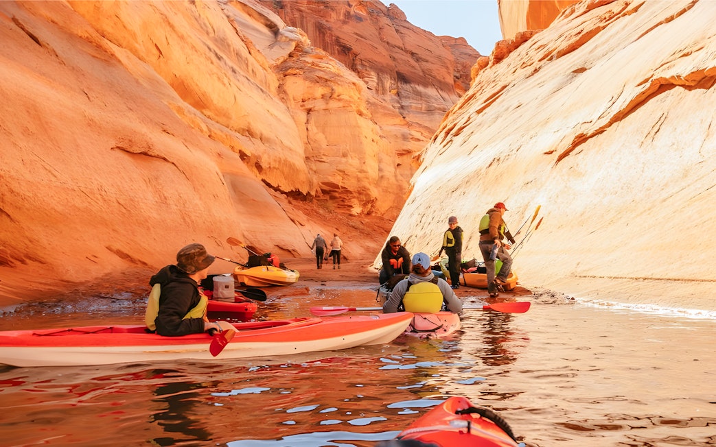 Kayakers navigating through Antelope Canyon on Lake Powell.