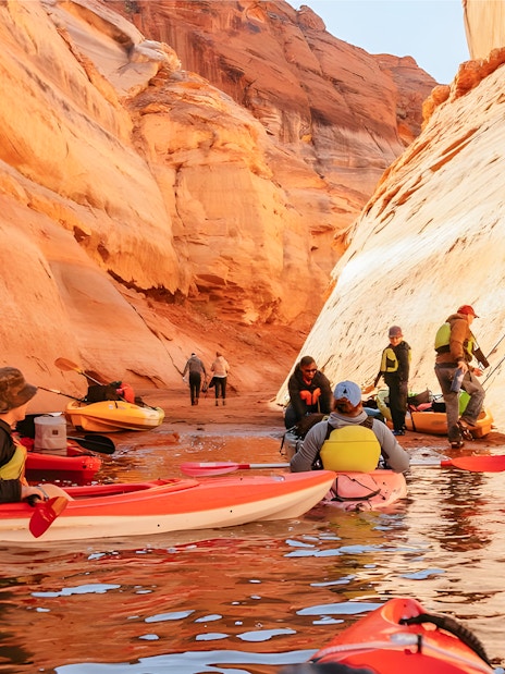 Kayakers navigating through Antelope Canyon on Lake Powell.