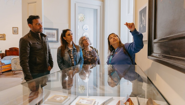 Tour group observing artwork during Pena Palace guided tour.