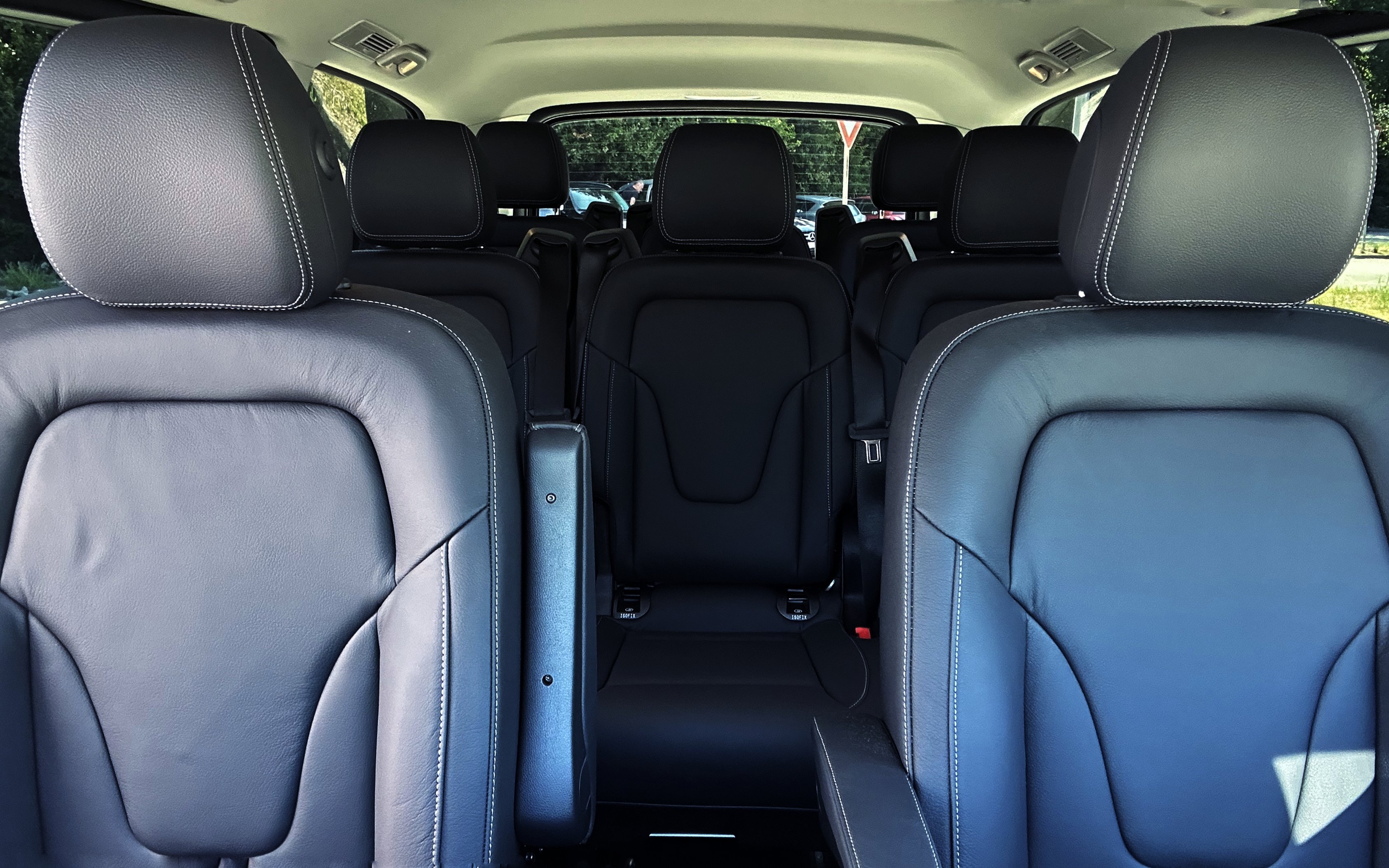 Mercedes E Class interior with black leather seats and spacious rear seating arrangement.