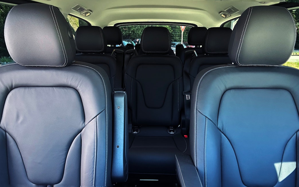 Mercedes E Class interior with black leather seats and spacious rear seating arrangement.
