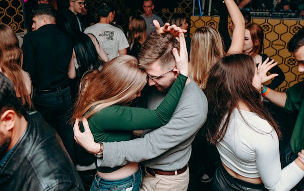 People dancing in a Krakow nightclub during a Krawl through Krakow tour.