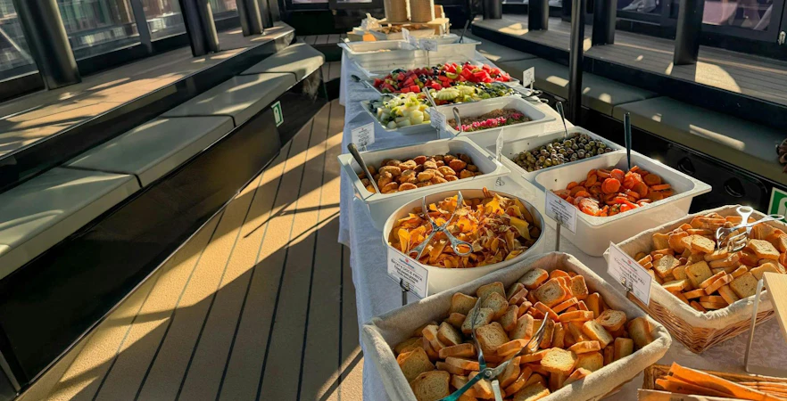 Buffet spread on a boat deck during Albufeira Algarve sunset sailing tour.