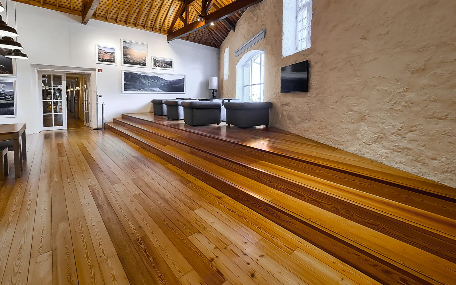 Graham's Port Lodge interior with seating area and wooden floors.