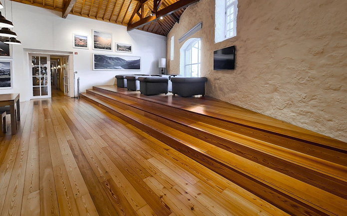 Graham's Port Lodge interior with seating area and wooden floors.