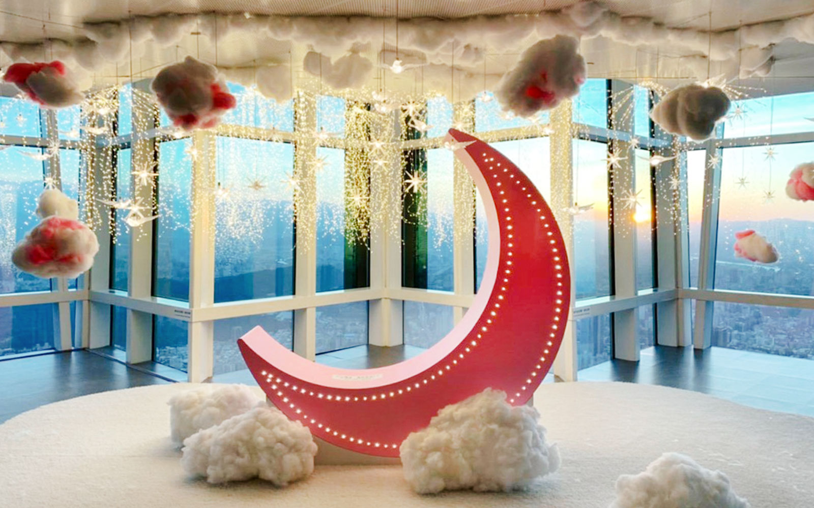 Exhibit with crescent moon and clouds at Shangri-La Gardens, Taipei 101.