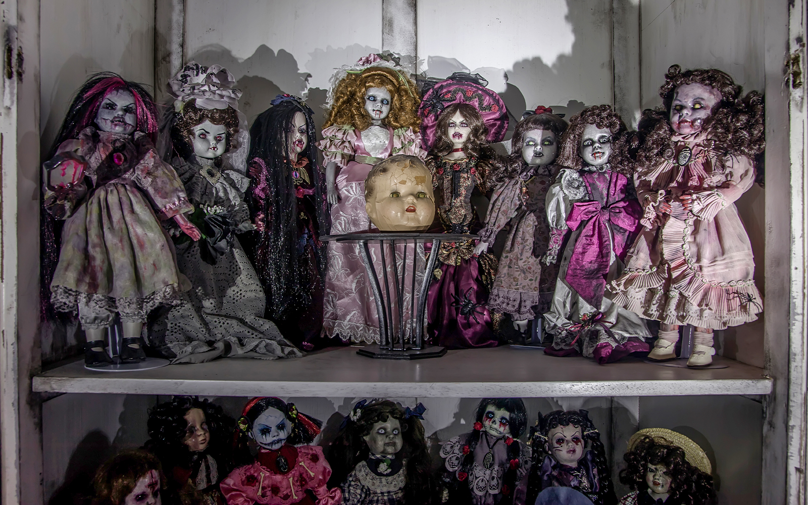 Scary dolls on a shelf in Haunted Museum, Las Vegas.