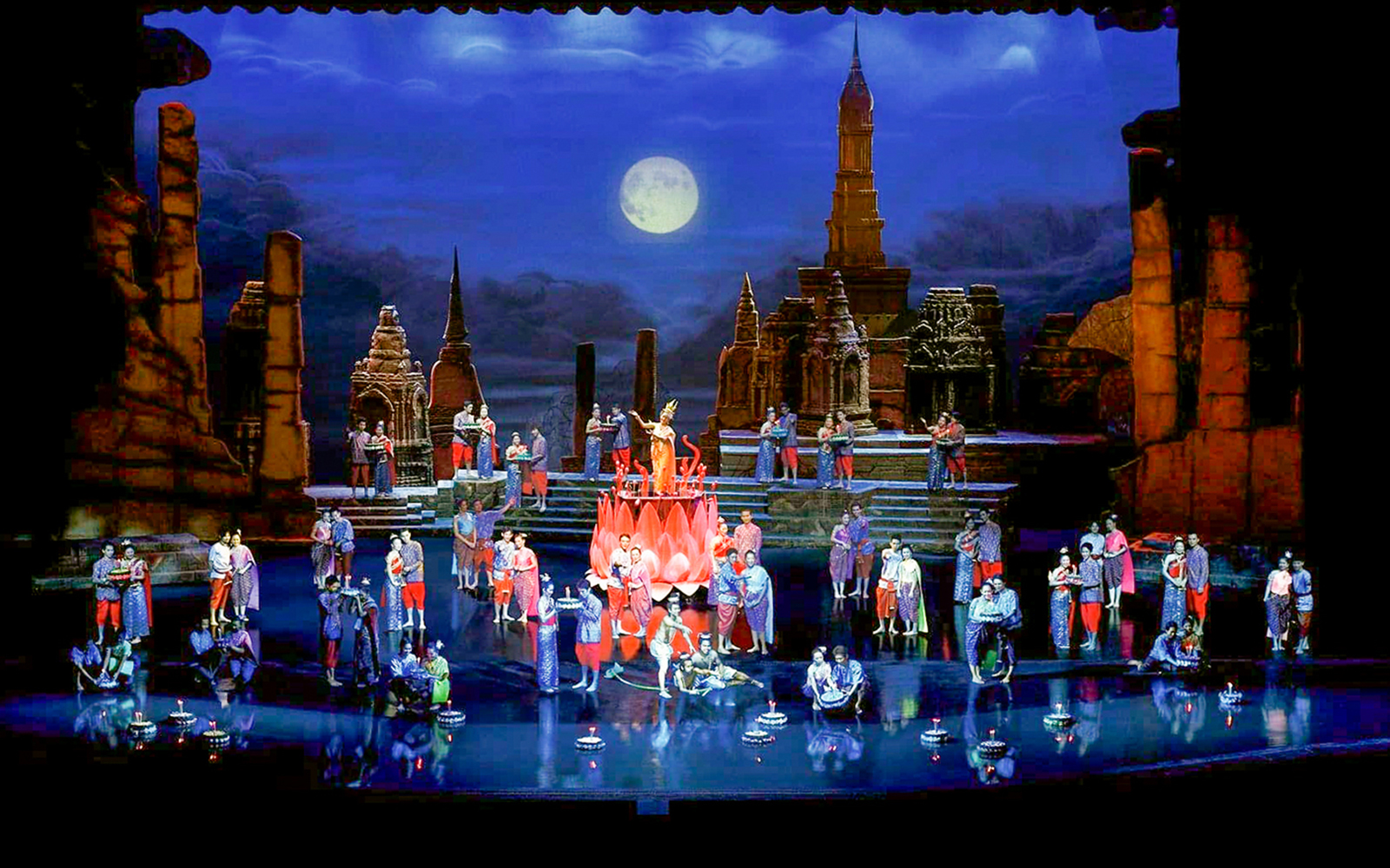 Siam Niramit Phuket stage performance with traditional Thai costumes and ancient temple backdrop.