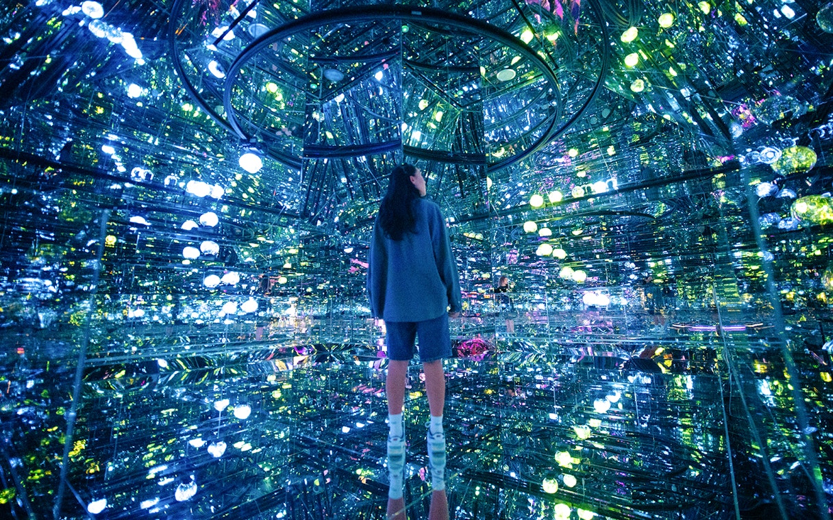 Tourists engaging with digital art installations at House of Hype, an interactive experience in New York City.