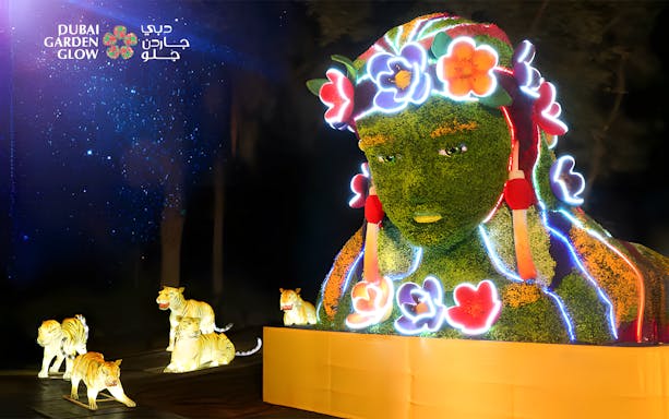 Dubai Garden Glow illuminated sculpture with floral design and glowing tigers.