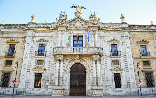 Facade of the Royal Tobacco Factory in Seville on a guided monumental walking tour.