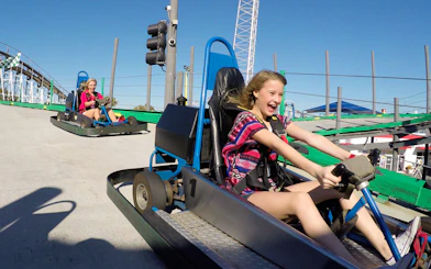 Young girl driving a go-kart at Fun Spot America.
