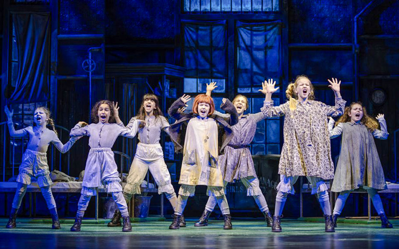 Children performing a musical number in the Annie stage show.