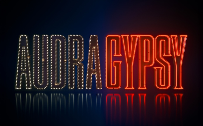Neon sign displaying 'Audra Gypsy' in illuminated letters