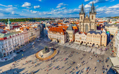 Aerial view of Prague's Old Town Square with Tyn Church and Jan Hus monument.