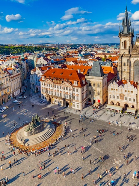 Aerial view of Prague's Old Town Square with Tyn Church and Jan Hus monument.
