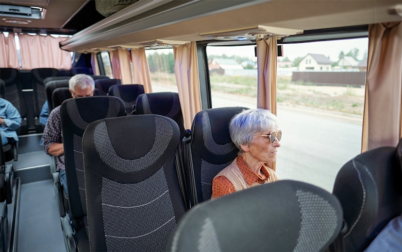 Bus interior with passengers traveling from Madrid to Puy du Fou España.