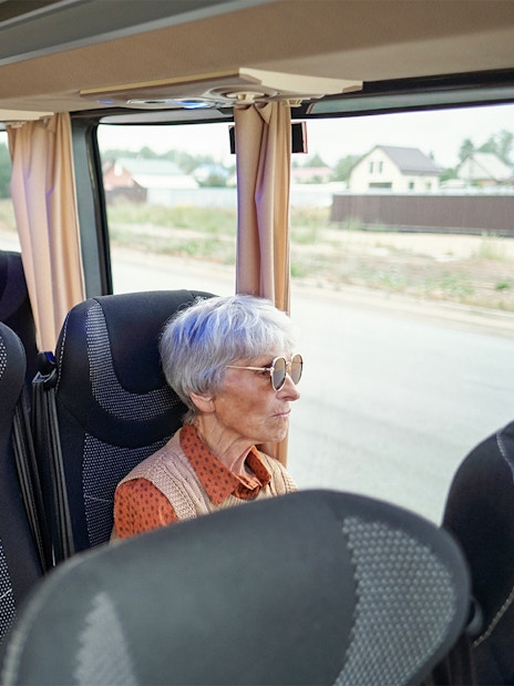 Bus interior with passengers traveling from Madrid to Puy du Fou España.
