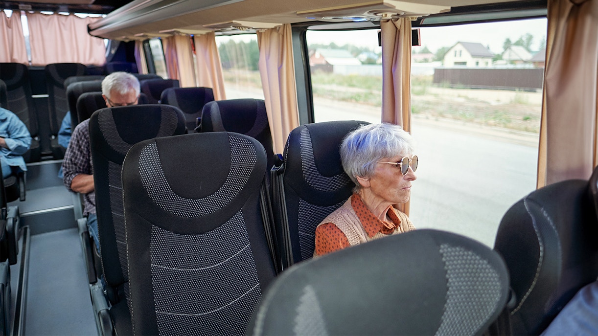 woman sitting inside bus